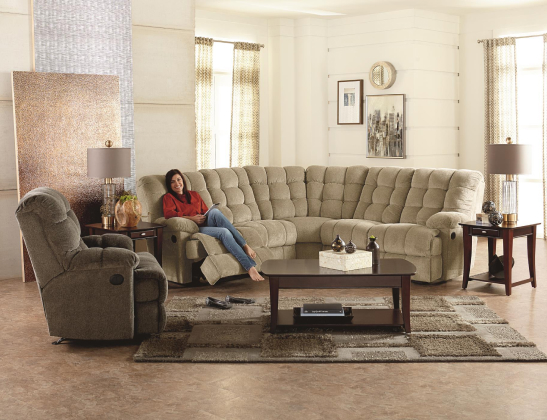 a woman resting on a round, taupe, soft-backed sectional couch